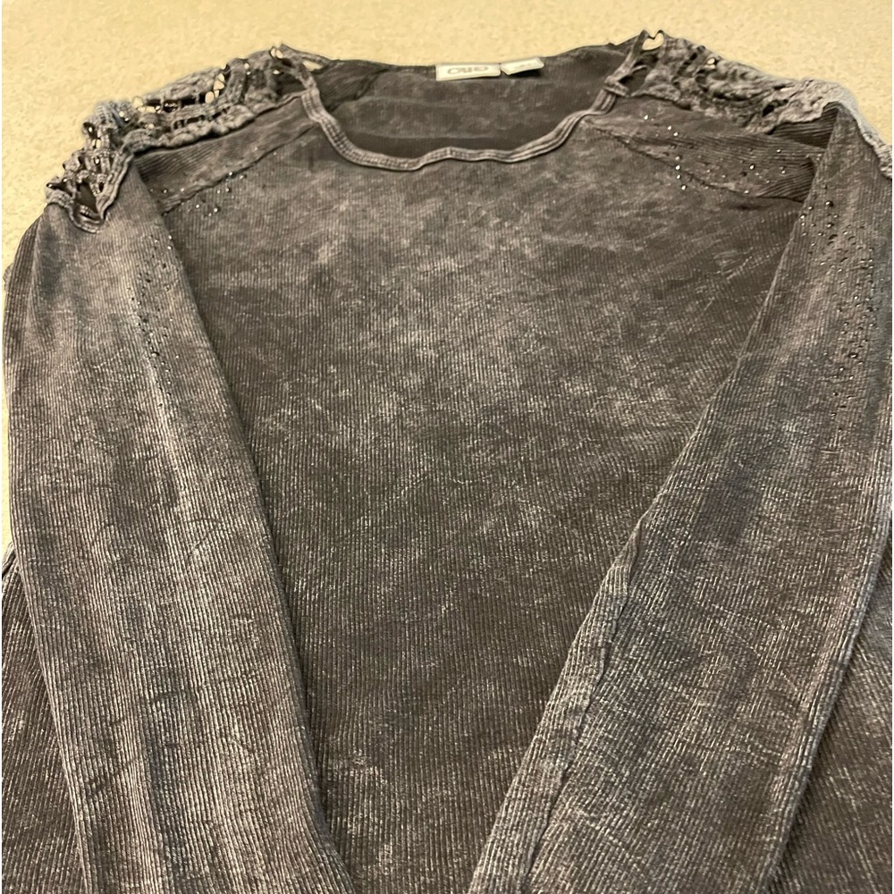 Cato top size S with crochet shoulders and black rhinestones.